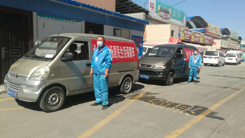 图为：副食市场居民生活保障供应车辆_副本.jpg